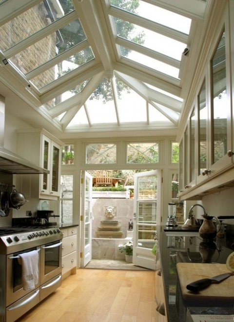 Kitchen and conservatory - Photo found on homedit.com