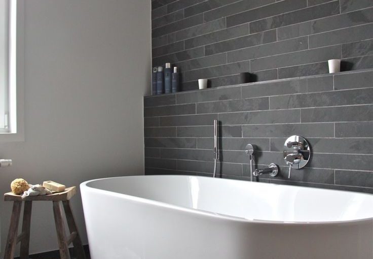 Transform Your Bathroom Into A Luxury Space In 5 Easy Steps - White Free Standing Bath, Grey Slated Walls & Wooden Stool.
