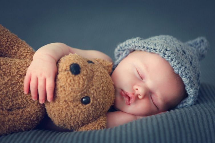 Baby With Grey Hat And Teddie Bear