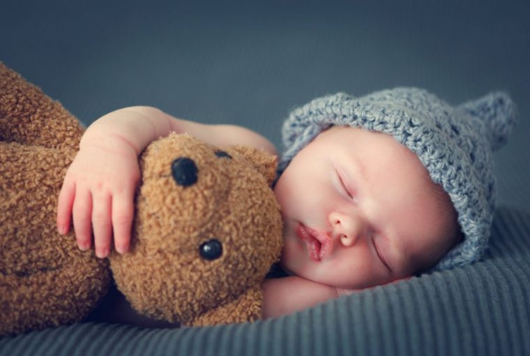 Baby With Grey Hat And Teddie Bear