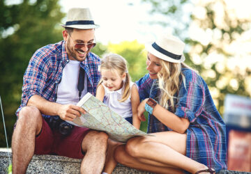 Family looking at a map. Family planing holiday.