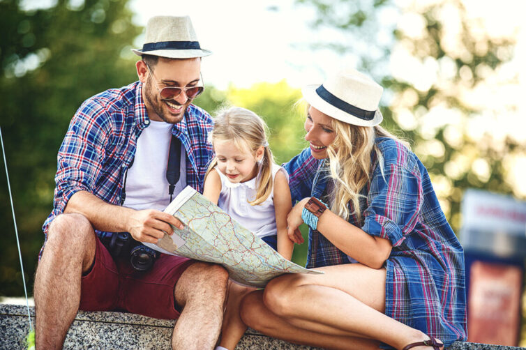 Family looking at a map. Family planing holiday.