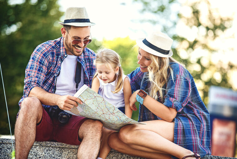 Family looking at a map. Family planing holiday.