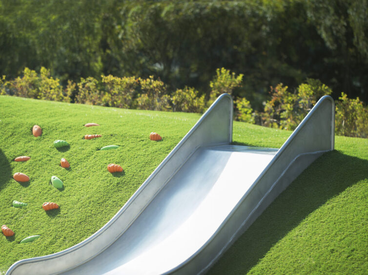 Synthetic grass kids placy area and slide