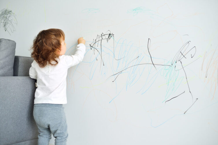 Child drawing on lounge wall