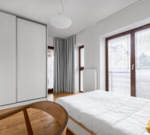 Bedroom with white sliding wardrobe doors