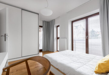 Bedroom with white sliding wardrobe doors