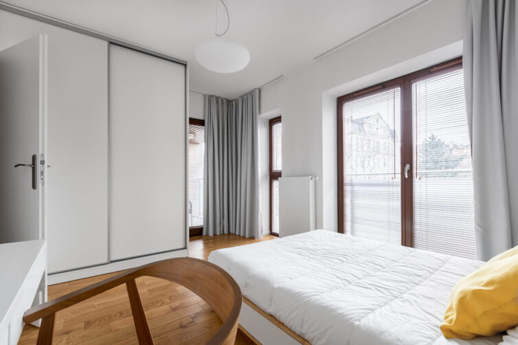 Bedroom with white sliding wardrobe doors