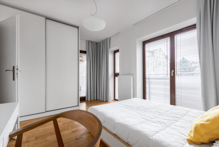 Bedroom with white sliding wardrobe doors