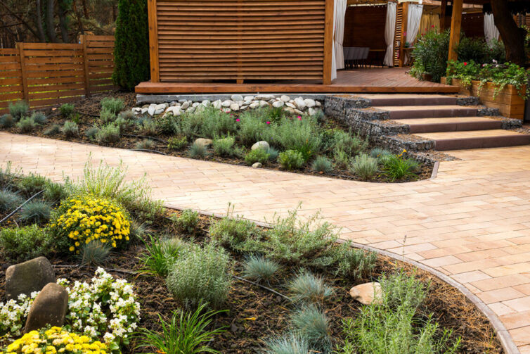 Stone path and flower beds in garden