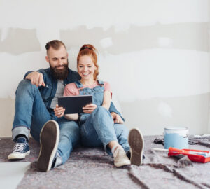 Couple doing DIY and looking at ipad