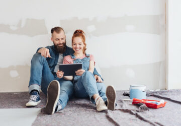 Couple doing DIY and looking at ipad