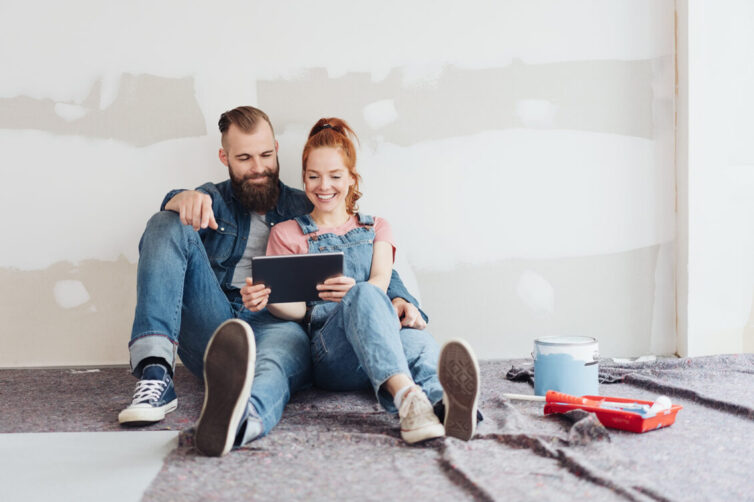 Couple doing DIY and looking at ipad