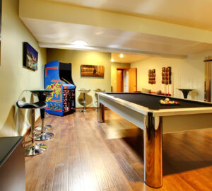 Games room with pool table and arcade game