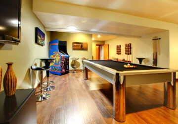 Games room with pool table and arcade game