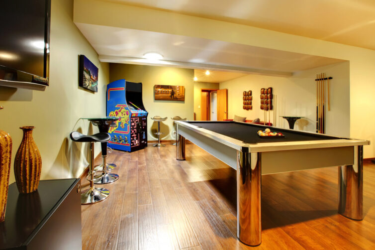 Games room with pool table and arcade game