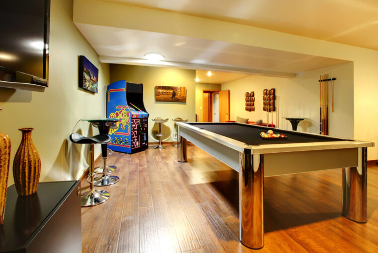 Games room with pool table and arcade game