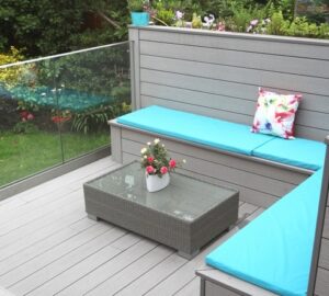 Grey composite decking and seating with blue cushioning