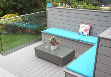 Grey composite decking and seating with blue cushioning