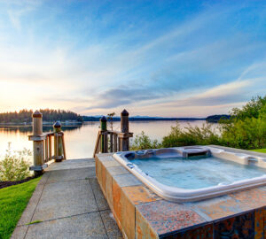 Hot tub in garden with sea views