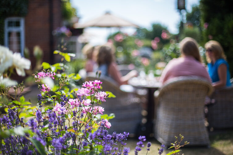 Relaxing with family in the garden. Garden table and chairs