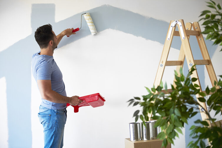 Man painting wall