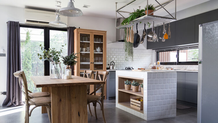 Eclectic Kitchen with real wood table and cupboard, ,metal hanging shelves and modern kitchen cabinets