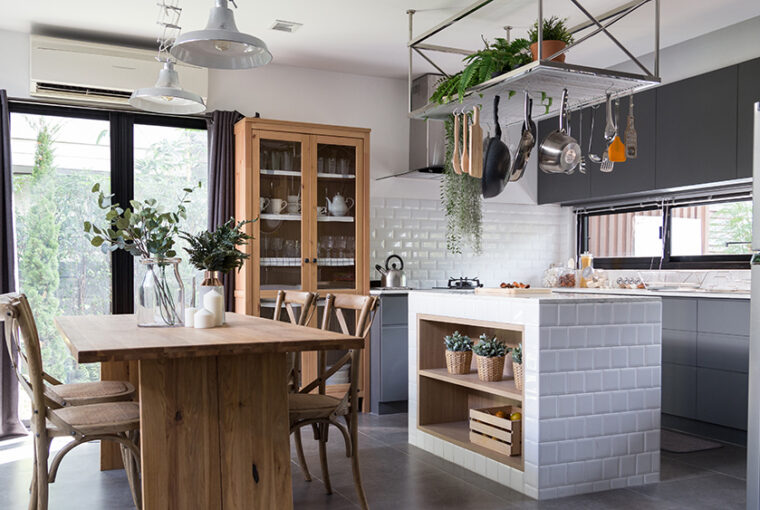 Eclectic Kitchen with real wood table and cupboard, ,metal hanging shelves and modern kitchen cabinets