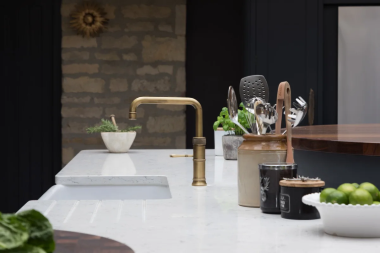 Bespoke kitchen with brass tap