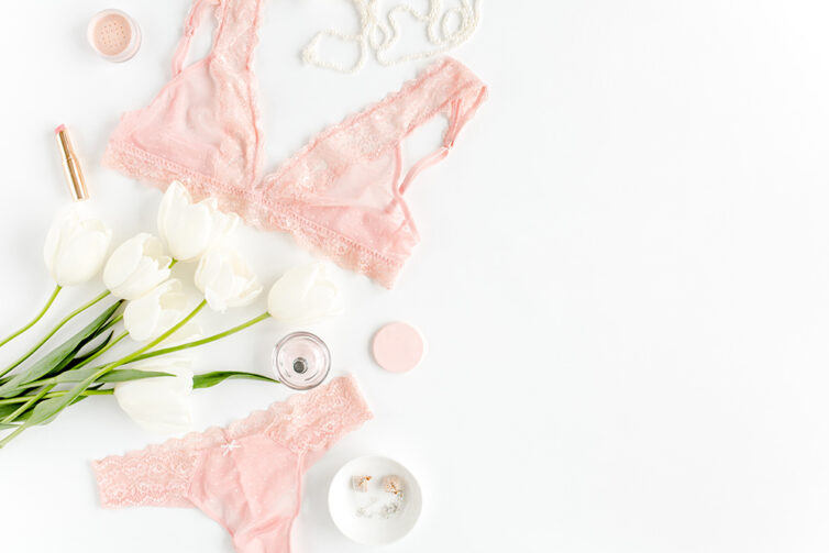 Pink underwear, lacy lingerie and white tulips