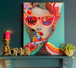 Gianna LED Neon Canvas Art £265. Ornate Leaping Fish Candle Holder £32.95. Gold OMG Balloon Ornament & Wall Décor £38.95.