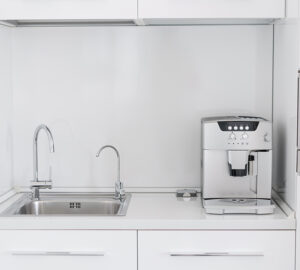 Kitchen with coffee machine and built in water filter