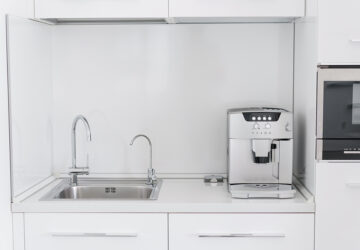 Kitchen with coffee machine and built in water filter