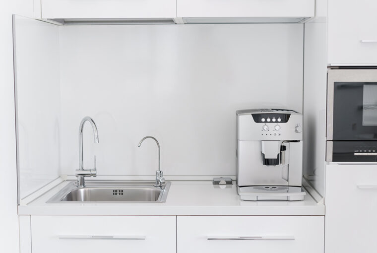 Kitchen with coffee machine and built in water filter