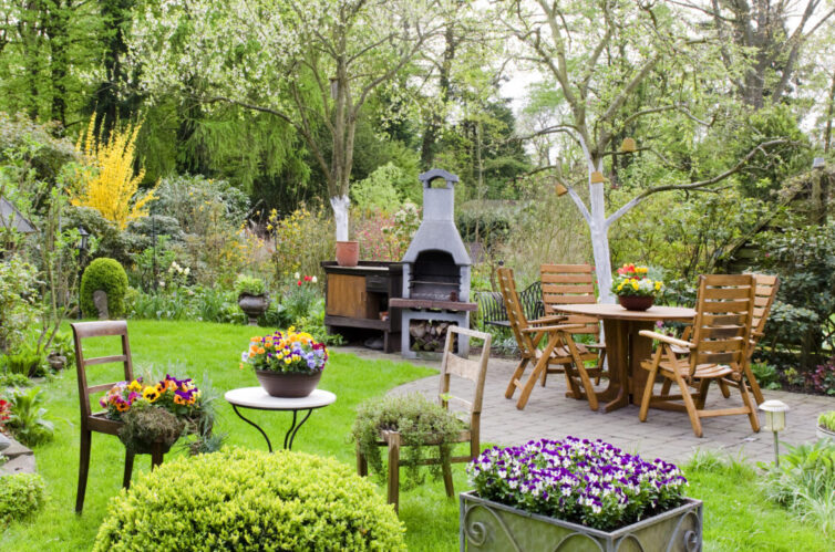 Garden with wooden furniture and pizza oven