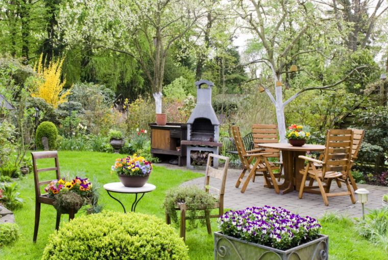Garden with wooden furniture and pizza oven