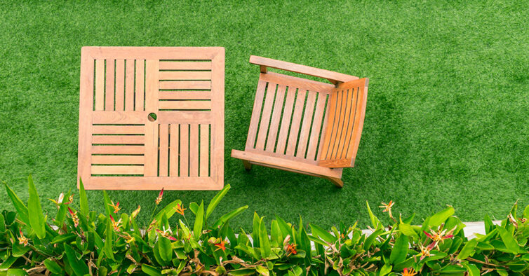 Artificial grass with wooden table and chairs