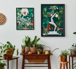 Living room with vintage retro shelf and tables with house plants, cacti. Yoga posta poster framed on the white wall.