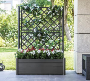 Large planter with decorative trellis.