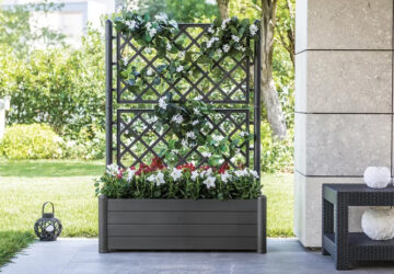 Large planter with decorative trellis.