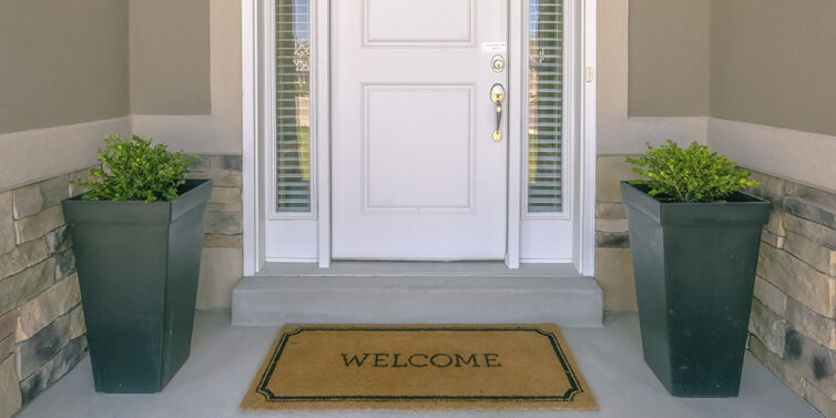 Entrance to house with welcome doormat