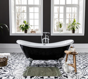 Bathroom with black painted walls and black roll top bath