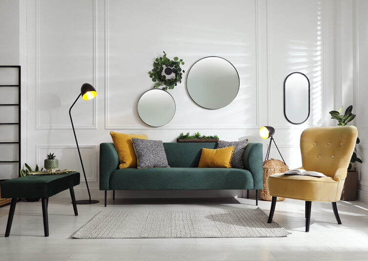 Loung with dark green sofa and mustard coloured slipper chair