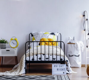 Black and yellow bedroom. Designed around black metal bed