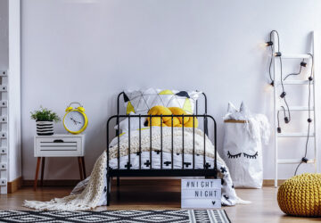 Black and yellow bedroom. Designed around black metal bed