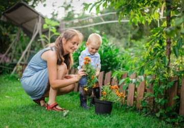 Women and child planting plants in the garden