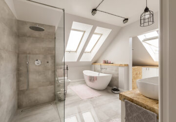 Modern bathroom with freestanding white bath and large walk in shower