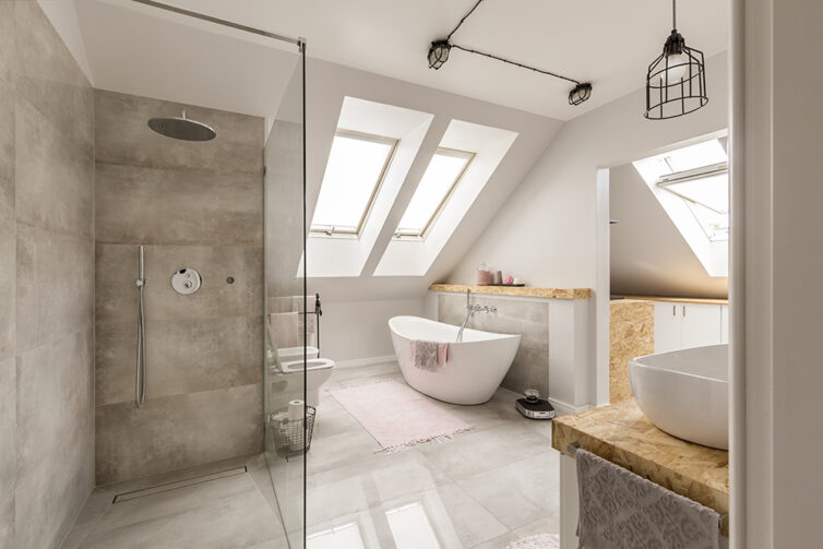 Modern bathroom with freestanding white bath and large walk in shower