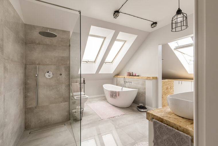 Modern bathroom with freestanding white bath and large walk in shower