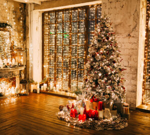 Christmas lighing on christmas tree, walls and windows